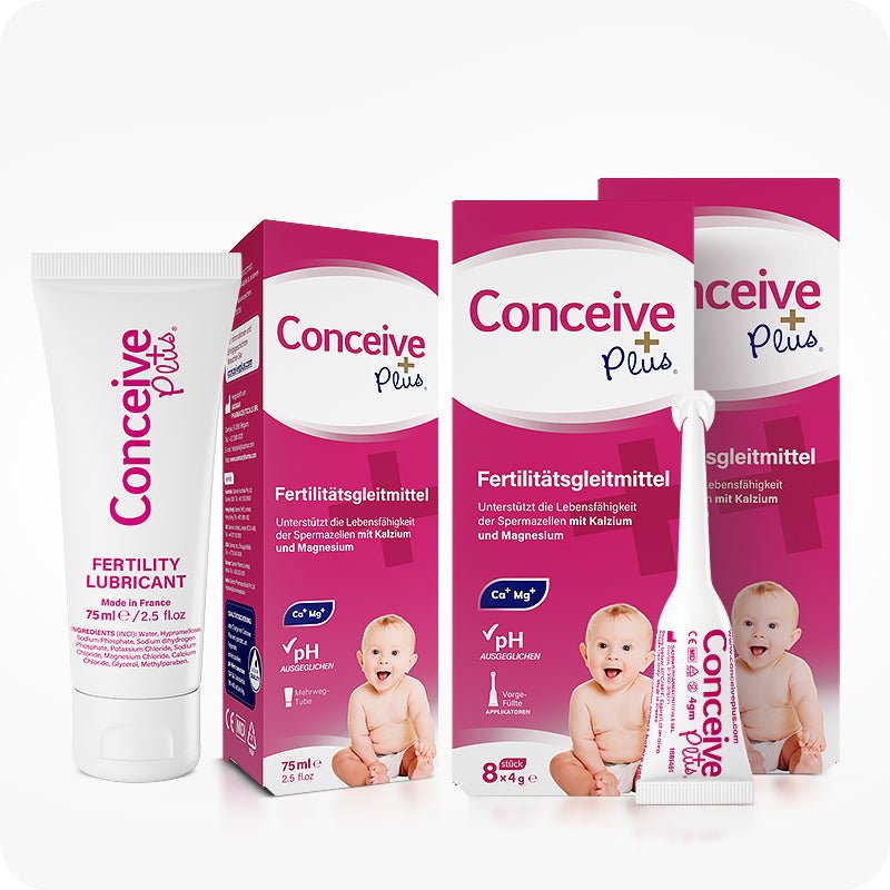 Conceive Plus Fertility Combo Lubricant 75ml + 16 Applicators (DE), product display featuring a 75ml fertility lubricant tube, two magenta-and-white applicator boxes labeled "Fertilitatsgleitmittel," and one pre-filled vaginal applicator placed upright in front—all arranged on white background with soft lighting to highlight German packaging, branding elements, and baby imagery.