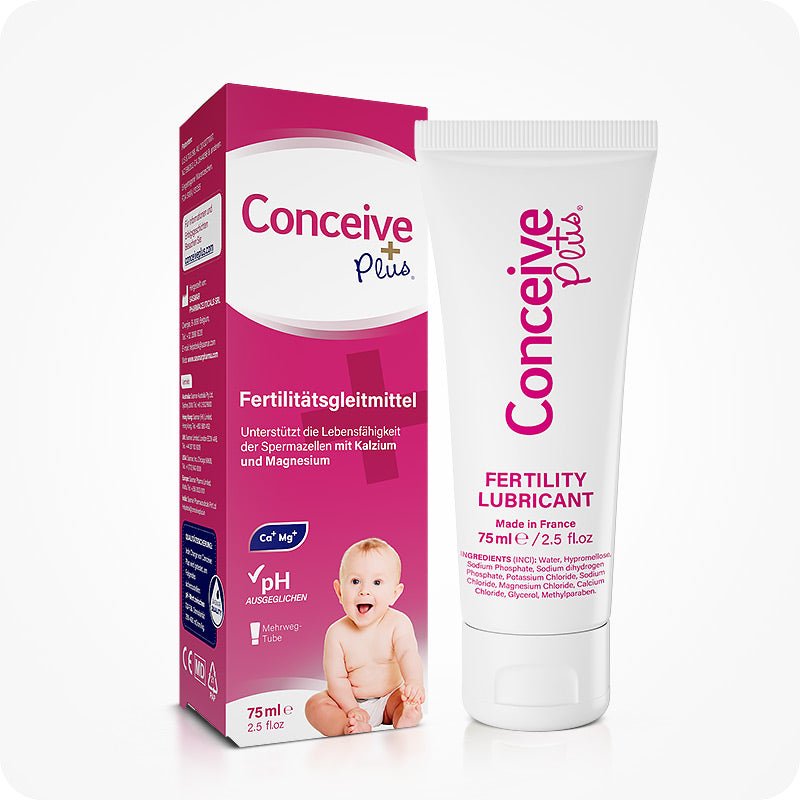 For Conceive Plus Men's Fertility Support + Lubricant (DE), image of 75ml fertility lubricant tube and its matching pink German-language box with a baby photo and key benefits like calcium, magnesium, and balanced pH prominently displayed on packaging.