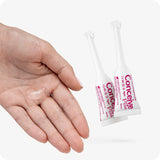 For Conceive Plus Fertility Lubricant Combo 75ml + 8 applicators (DE), showing two 4g pre-filled fertility lubricant applicators next to a hand with a visible drop of clear lubricant, illustrating product texture and ease of use for fertility support in a German-labeled combo pack.