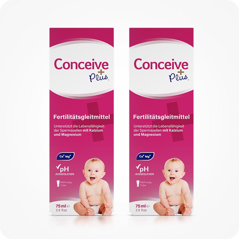 Two boxes of Conceive Plus Fertility Lubricant 75ml displayed side by side on a white background. Each pink and white box features German labeling, a baby image, and icons highlighting calcium, magnesium, and pH balance for reproductive support.