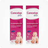 For Conceive Plus Men's Fertility Support + Lubricant (DE), two-pack of 75ml fertility lubricant boxes in German, each featuring a balanced pH symbol and calcium-magnesium ions icons, with a smiling baby image on front.